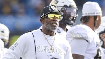 Nov 8, 2025; Morgantown, West Virginia, USA; Colorado Buffaloes head coach Deion Sanders watches the big screen during a replay during the first quarter against the West Virginia Mountaineers at Milan Puskar Stadium.