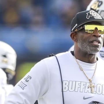 Nov 8, 2025; Morgantown, West Virginia, USA; Colorado Buffaloes head coach Deion Sanders watches the big screen during a replay during the first quarter against the West Virginia Mountaineers at Milan Puskar Stadium.