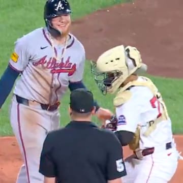 Alex Verdugo laughs off a very not close play at home. 