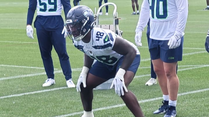 Seahawks rookie linebacker Tyrice Knight prepares to take on a two-man sled during a drill at the team's second OTA practice.