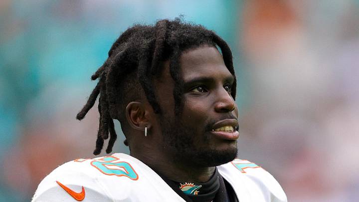 Sep 24, 2023; Miami Gardens, Florida, USA;  Miami Dolphins wide receiver Tyreek Hill (10) looks on from the sidelines against the Denver Broncos in the fourth quarter at Hard Rock Stadium. Mandatory Credit: Nathan Ray Seebeck-Imagn Images