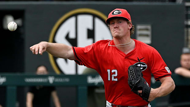 Georgia pitcher Leighton Finley (12) throws to first base on an attempted pick off play during the second inning.