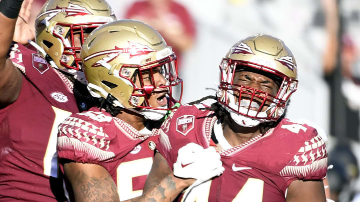 Oct 1, 2022; Tallahassee, Florida, USA; Florida State Seminoles defensive end Patrick Payton (56) celebrates a sack with defensive tackle Joshua Farmer (44) during the second half against the Wake Forest Demon Deacons at Doak S. Campbell Stadium. Mandatory Credit: Melina Myers-USA TODAY Sports