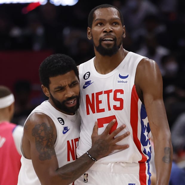 Brooklyn Nets guard Kyrie Irving (11) celebrates with Nets forward Kevin Durant (7)