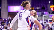 Sedona Prince and Hailey Van Lith celebrate during a game.