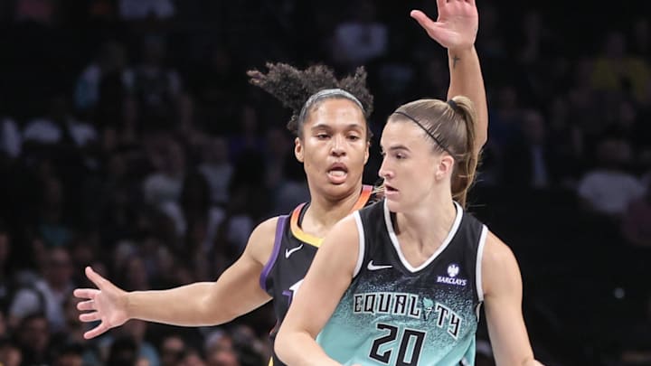 Jul 25, 2025; Brooklyn, New York, USA; New York Liberty guard Sabrina Ionescu (20) looks to drive past Phoenix Mercury forward Alyssa Thomas (25) in the first quarter at Barclays Center. Mandatory Credit: Wendell Cruz-Imagn Images Jul 25, 2025; Brooklyn, New York, USA; New York Liberty guard Sabrina Ionescu (20) looks to drive past Phoenix Mercury forward Alyssa Thomas (25) in the first quarter at Barclays Center. Mandatory Credit: Wendell Cruz-Imagn Images