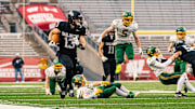 Darlington quarterback Zeke Zuberbuhler (13) sprints down the right side line during the WIAA Division 6 state championship game.