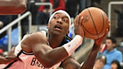 Nov 23, 2025; Toronto, Ontario, CAN;  Brooklyn Nets guard Terance Mann (14) controls the ball as Toronto Raptors guard Immanuel Quickley (5) defends in the first half at Scotiabank Arena. Mandatory Credit: Dan Hamilton-Imagn Images
