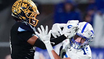 Moeller Crusaders defensive back blocks a pass to in the first half of a Division I regional semifinal high school football game between the St. Xavier Bombers and Moeller Crusaders, Friday, Nov. 14, 2025, at Welcome Stadium in Dayton.