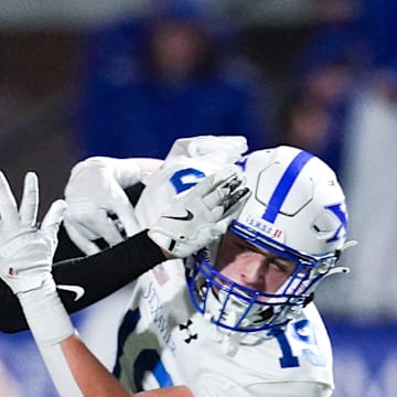 Moeller Crusaders defensive back blocks a pass to in the first half of a Division I regional semifinal high school football game between the St. Xavier Bombers and Moeller Crusaders, Friday, Nov. 14, 2025, at Welcome Stadium in Dayton.