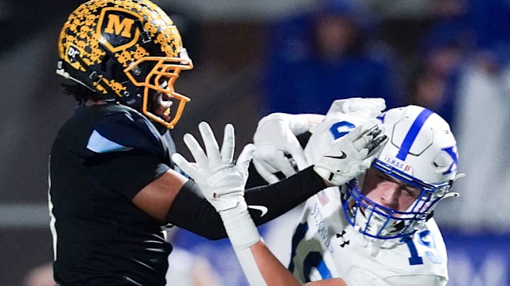 Moeller Crusaders defensive back blocks a pass to in the first half of a Division I regional semifinal high school football game between the St. Xavier Bombers and Moeller Crusaders, Friday, Nov. 14, 2025, at Welcome Stadium in Dayton.
