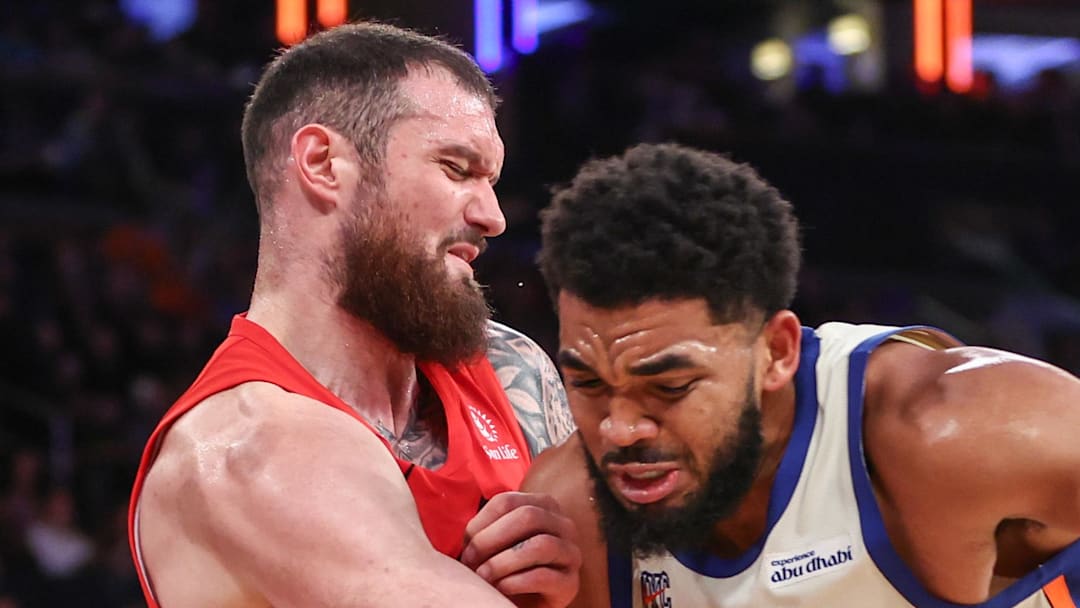 New York Knicks center Karl-Anthony Towns looks to post up against Toronto Raptors forward Sandro Mamukelashvili