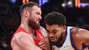 New York Knicks center Karl-Anthony Towns looks to post up against Toronto Raptors forward Sandro Mamukelashvili