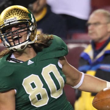 November 12, 2011; College Park, MD, USA;  Notre Dame Fighting Irish tight end Tyler Eifert (80) celebrates his second half touchdown catch and run against the Maryland Terrapins at FedEx Field. Mandatory Credit: Mitch Stringer-Imagn Images