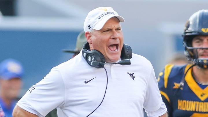 Sep 13, 2025; Morgantown, West Virginia, USA; West Virginia Mountaineers head coach Rich Rodriguez yells at the referee during the second quarter against the Pittsburgh Panthers at Milan Puskar Stadium. Mandatory Credit: Ben Queen-Imagn Images