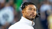 Oct 11, 2025; South Bend, Indiana, USA; Notre Dame Fighting Irish head coach Marcus Freeman talks with an official against the NC State Wolfpack during the second half at Notre Dame Stadium. 