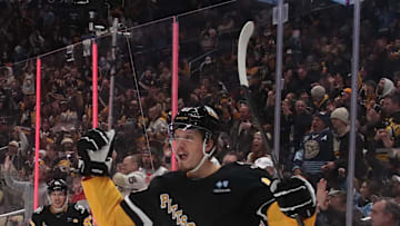 Jan 7, 2025; Pittsburgh, Pennsylvania, USA; Pittsburgh Penguins right wing Rickard Rakell (67) reacts after scoring a goal against the Columbus Blue Jackets during the third period at PPG Paints Arena. Mandatory Credit: Charles LeClaire-Imagn Images