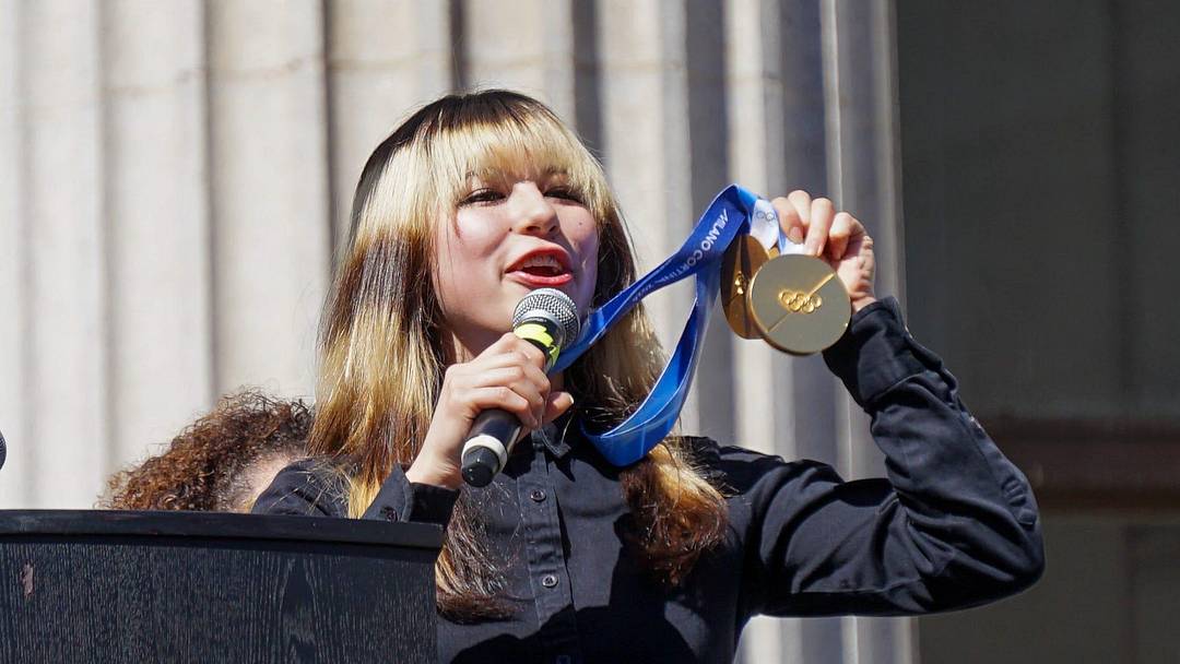Olympic gold medalist Alysa Liu shows off her two gold medals during the City of Oakland's Alysa Liu celebration rally, on Thursday, March 13, 2026, in Oakland, CA.