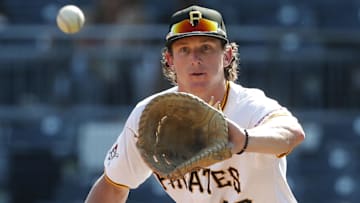 Sep 14, 2024; Pittsburgh, Pennsylvania, USA;  Pittsburgh Pirates first baseman Billy Cook (28) takes a throw to retire Kansas City Royals outfielder Hunter Renfroe (not pictured) during the eighth inning at PNC Park. Mandatory Credit: Charles LeClaire-Imagn Images