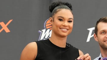 Mercury forward Satou Sabally holds her jersey during a news conference at the Phoenix Mercury Practice Facility after signing as a free agent.