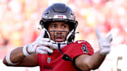 Jan 5, 2025; Tampa, Florida, USA;  Tampa Bay Buccaneers wide receiver Jalen McMillan (15) celebrates after catching a pass in the second half  against the New Orleans Saints at Raymond James Stadium. Mandatory Credit: Jonathan Dyer-Imagn Images