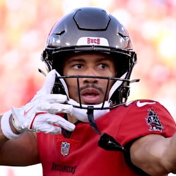 Jan 5, 2025; Tampa, Florida, USA;  Tampa Bay Buccaneers wide receiver Jalen McMillan (15) celebrates after catching a pass in the second half  against the New Orleans Saints at Raymond James Stadium. Mandatory Credit: Jonathan Dyer-Imagn Images