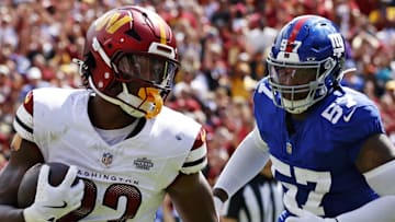 Sep 7, 2025; Landover, Maryland, USA; Washington Commanders running back Jacory Croskey-Merritt (22) scores a touchdown during the second quarter against the New York Giants at Northwest Stadium. Mandatory Credit: Peter Casey-Imagn Images