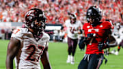 Sep 27, 2025; Raleigh, North Carolina, USA;  Virginia Tech Hokies running back Marcellous Hawkins (27) makes a touchdown and celebrates during the first half of the game against North Carolina State Wolfpack at Carter-Finley Stadium. Mandatory Credit: Jaylynn Nash-Imagn Images
