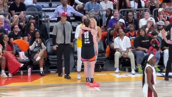 Caitlin Clark and Sophie Cunningham embrace during the 2024 WNBA All-Star Game.