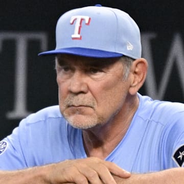 Apr 20, 2025; Arlington, Texas, USA; Texas Rangers manager Bruce Bochy (15) looks on from the dugout during the seventh inning against the Los Angeles Dodgers at Globe Life Field