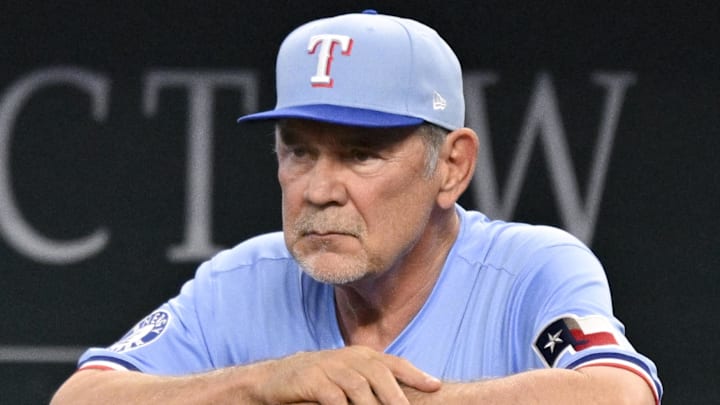 Apr 20, 2025; Arlington, Texas, USA; Texas Rangers manager Bruce Bochy (15) looks on from the dugout during the seventh inning against the Los Angeles Dodgers at Globe Life Field