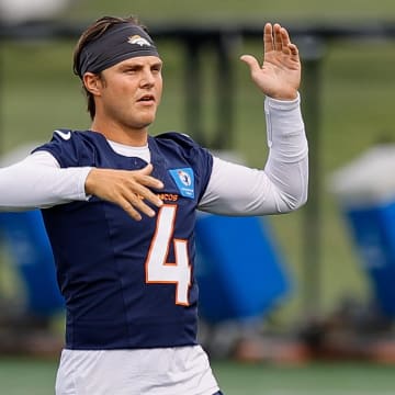 Jul 26, 2024; Englewood, CO, USA; Denver Broncos quarterback Zach Wilson (4) during training camp at Broncos Park Powered by CommonSpirit. 