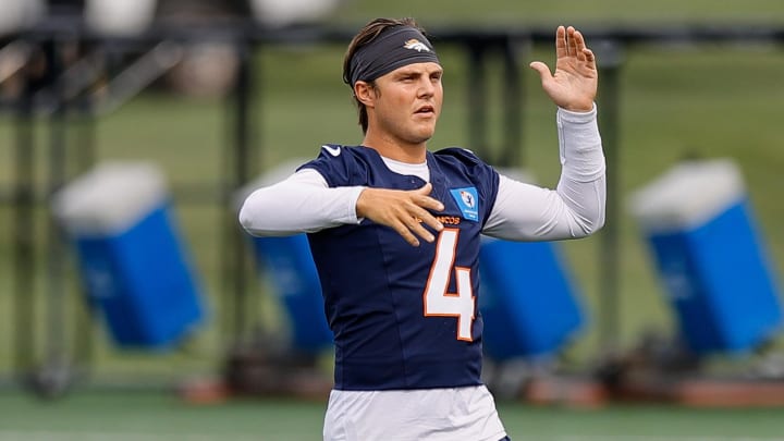 Jul 26, 2024; Englewood, CO, USA; Denver Broncos quarterback Zach Wilson (4) during training camp at Broncos Park Powered by CommonSpirit. 