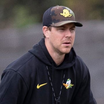 Oregon quarterback Dillon Gabriel throws out a pass as offensive coordinator Will Stein during practice with the Oregon Ducks Tuesday, Aug. 27, 2024 at the Hatfield-Dowlin Complex in Eugene, Ore.