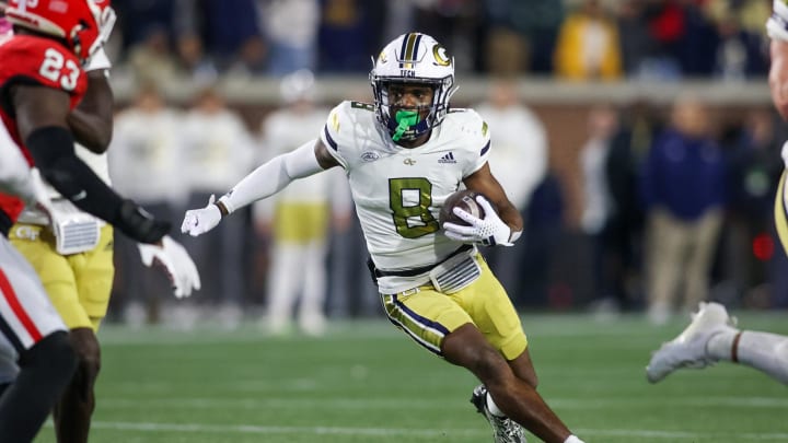 Nov 25, 2023; Atlanta, Georgia, USA; Georgia Tech Yellow Jackets wide receiver Malik Rutherford (8) runs the ball against the Georgia Bulldogs in the second quarter at Bobby Dodd Stadium at Hyundai Field. Mandatory Credit: Brett Davis-USA TODAY Sports