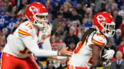Nov 2, 2025; Orchard Park, New York, USA; Kansas City Chiefs running back Elijah Mitchell (25) recieves a handoff from quarterback Patrick Mahomes (15) in the second quarter at Highmark Stadium. Mandatory Credit: Gregory Fisher-Imagn Images