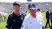 Apr. 21, 2007; South Bend, IN, USA;  Former Notre Dame Fighting Irish head coach Lou Holtz (left) and former Notre Dame head coach Ara Parseghian walk off the field following the Notre Dame Blue-Gold Game at Notre Dame Stadium. Holtz and Parseghian were guest coaches for the game. 