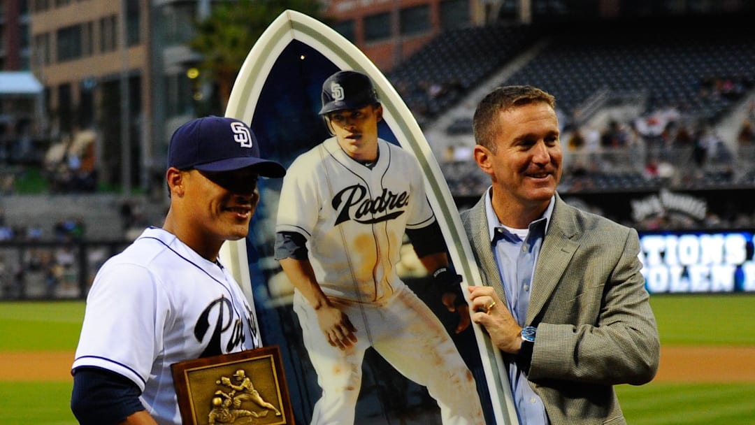 San Diego Padres shortstop Everth Cabrera (2) is awarded a surf board by general manager Josh Byrnes prior to the game against the Colorado Rockies at Petco Park on April 12, 2013.