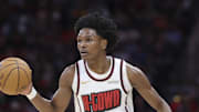 Feb 25, 2025; Houston, Texas, USA; Houston Rockets forward Amen Thompson (1) dribbles the ball during the first quarter against the Milwaukee Bucks at Toyota Center. Mandatory Credit: Troy Taormina-Imagn Images