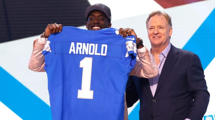 Terrion Arnold shows off his Detroit Lions jersey after getting drafted