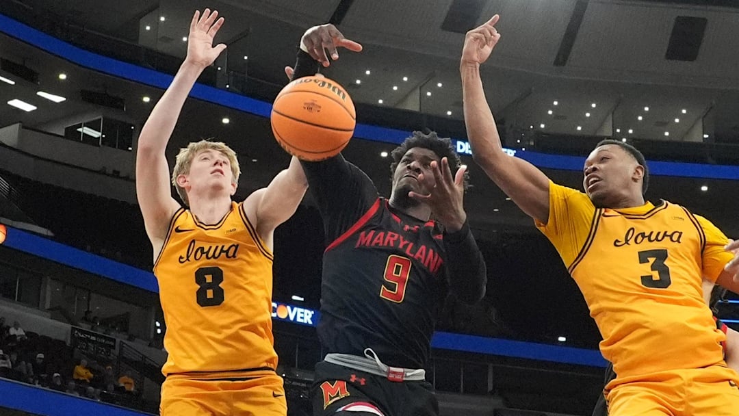 Mar 11, 2026; Chicago, IL, USA; Iowa Hawkeyes forward Cooper Koch (8)  forward Cam Manyawu (3 )and Maryland Terrapins forward Solomon Washington (9) go for the ball during the second half at United Center. Mandatory Credit: David Banks-Imagn Images