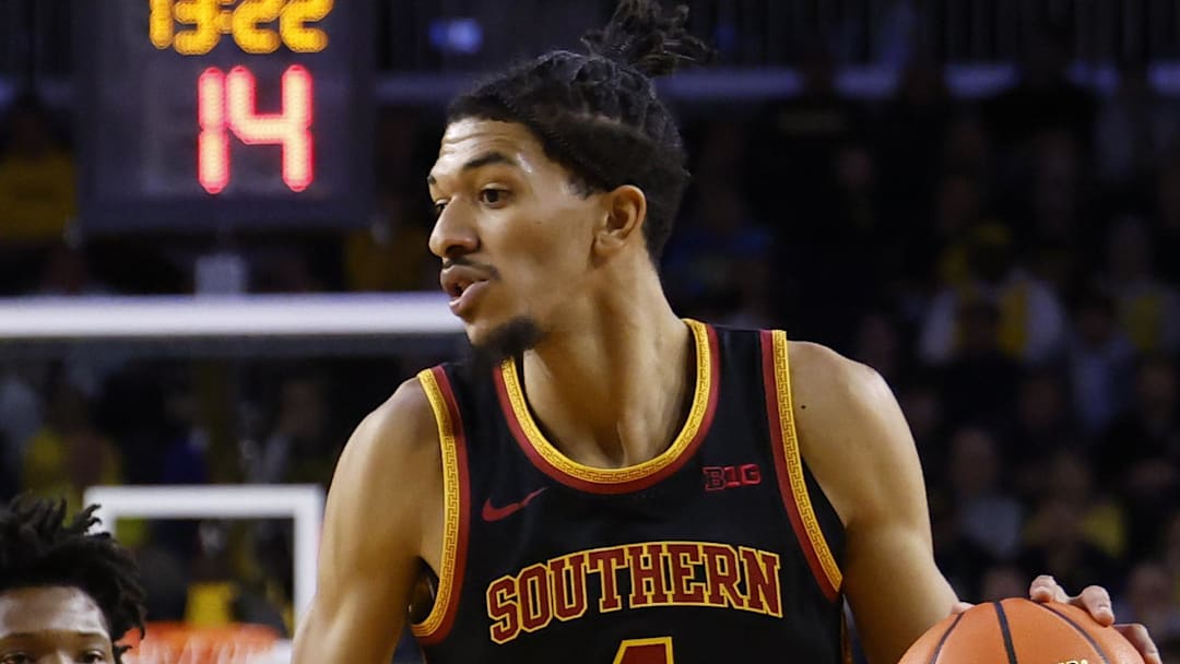 Jan 2, 2026; Ann Arbor, Michigan, USA;  Southern California Trojans forward Chad Baker-Mazara (4) dribbles on Michigan Wolverines guard L.J.Cason (2) in the second half at Crisler Center. 
