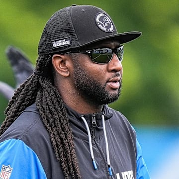 Detroit Lions defensive coordinator Kelvin Sheppard watches practice during training camp 