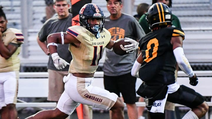 Xavier Lherisse of Eau Gallie is pursued by Chris Kelly of Merritt Island during their game Friday, September 29, 2023. Craig Bailey/FLORIDA TODAY via USA TODAY NETWORK