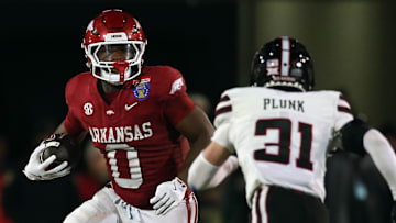 Dec 27, 2024; Memphis, TN, USA; Arkansas Razorbacks running back Braylen Russell (0) runs the ball during the third quarter against the Texas Tech Red Raiders at Simmons Bank Liberty Stadium. Mandatory Credit: Petre Thomas-Imagn Images