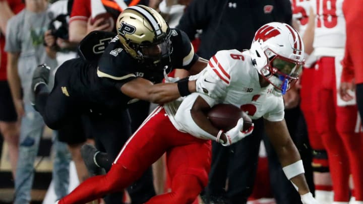 Purdue Boilermakers defensive back Markevious Brown (1) tackles Wisconsin Badgers wide receiver Will Pauling 