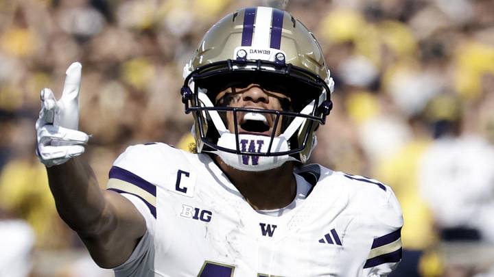 Oct 18, 2025; Ann Arbor, Michigan, USA;  Washington Huskies wide receiver Denzel Boston (12) celebrates after he makes a reception in the first half against the Michigan Wolverines at Michigan Stadium. Mandatory Credit: Rick Osentoski-Imagn Images