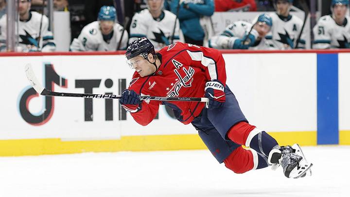 Jan 15, 2026; Washington, District of Columbia, USA; Washington Capitals defenseman John Carlson (74) shoots the puck against the San Jose Sharks during the third period at Capital One Arena. Mandatory Credit: Geoff Burke-Imagn Images