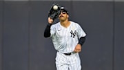 Sep 7, 2025; Bronx, New York, USA; New York Yankees center fielder Trent Grisham (12) catches a fly ball during the ninth inning against the Toronto Blue Jays at Yankee Stadium. Mandatory Credit: Mark Smith-Imagn Images