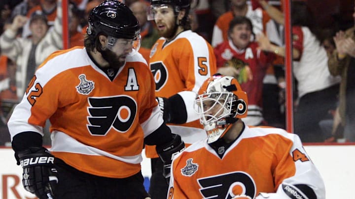 June 9, 2010; Philadelphia, PA, USA; Philadelphia Flyers goalie Michael Leighton (49) and left wing Simon Gagne (12) react after game six of the 2010 Stanley Cup Finals against the Chicago Blackhawks at the Wachovia Center. The Blackhawks won 4-3 to win the Stanley Cup.